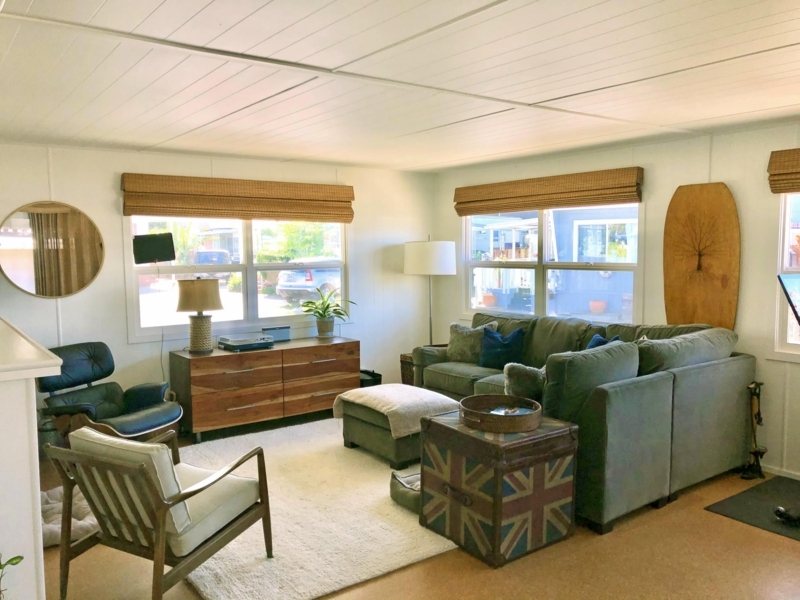 Mid-Century Living Room with Sage Green Sectional and Bamboo Shades