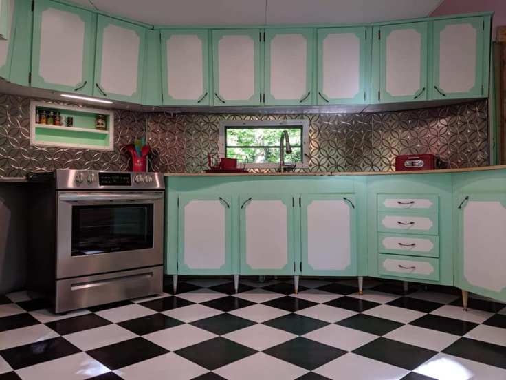 Mint Green Kitchen Cabinets and Metallic Textured Tile Backsplash