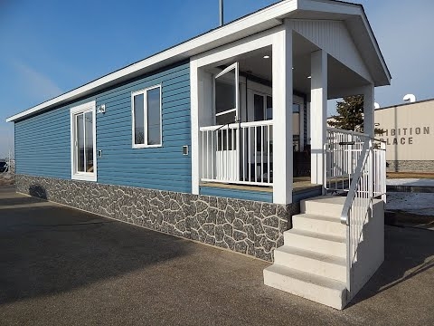 Mobile Home Blue Lap Siding with Stone Look Skirting Exterior Design