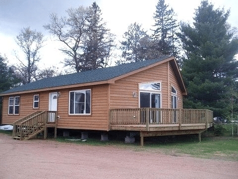 Mobile Home Cabin Style Exterior with Wrap Around Deck Addition Ideas