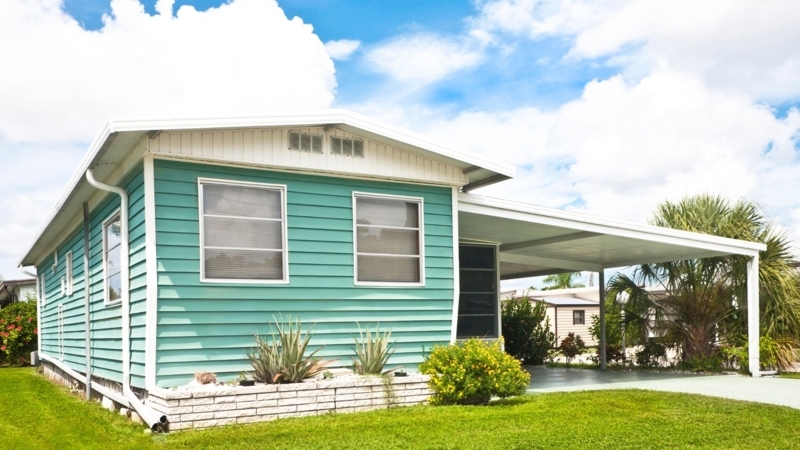 Mobile Home Coastal Style with Teal Siding and White Trim