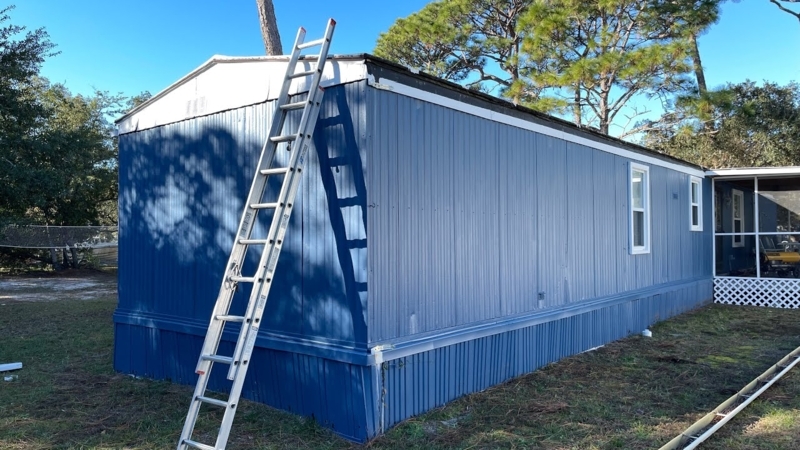 Mobile Home Cobalt Blue Vertical Siding with Lattice Skirting