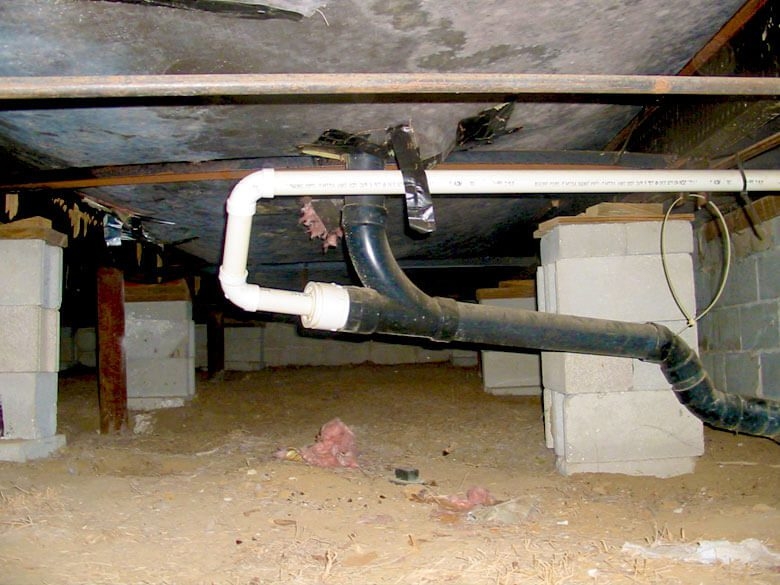 Mobile Home Crawl Space with Cinder Block Piers and Exposed Plumbing