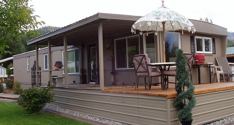 Mobile Home Deck Skirting Ideas with Corrugated Metal and Floral Umbrella