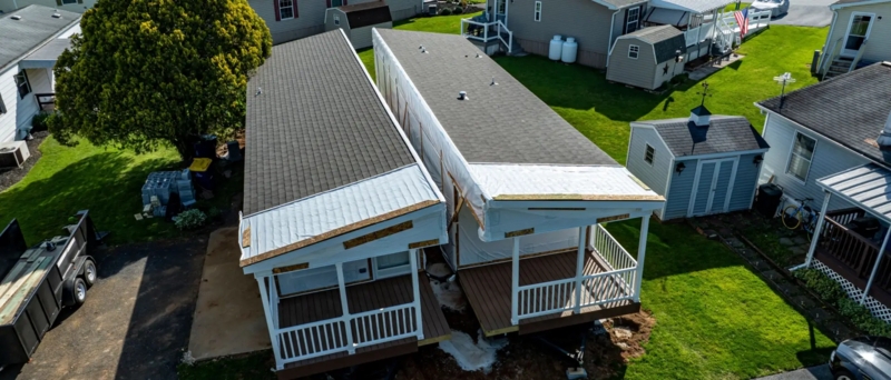 Mobile Home Double Wide With Shingle Roof And Integrated Porch