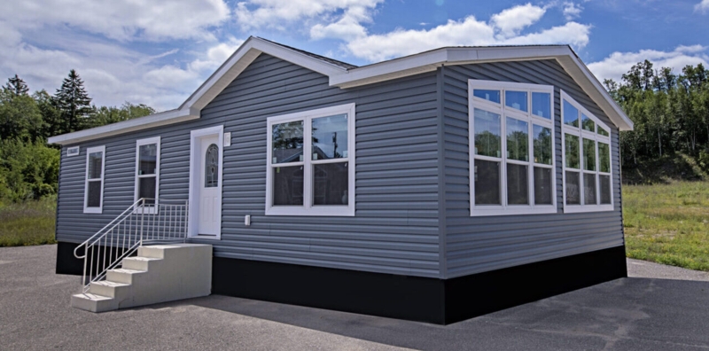 Mobile Home Exterior: Modern Gray Siding with Large Bay Windows