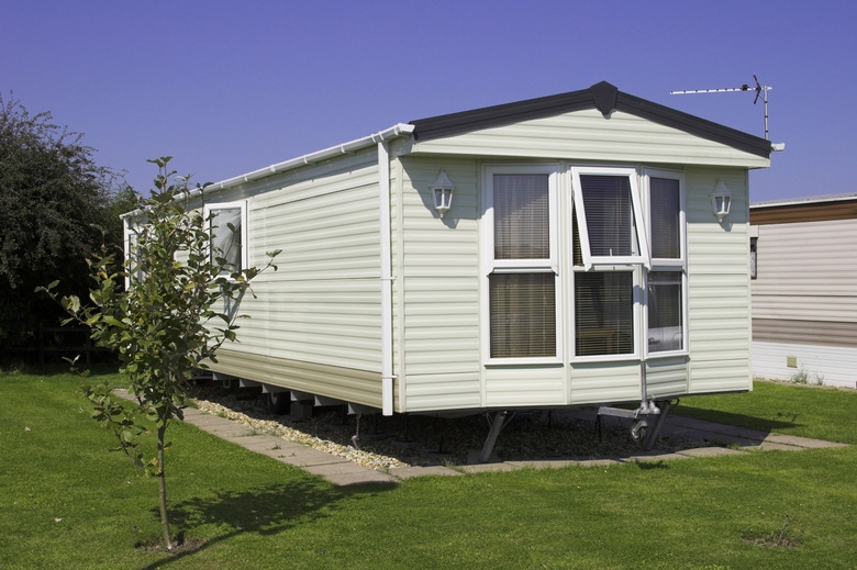 Mobile Home Exterior: Pale Green Siding with Crisp White Trim