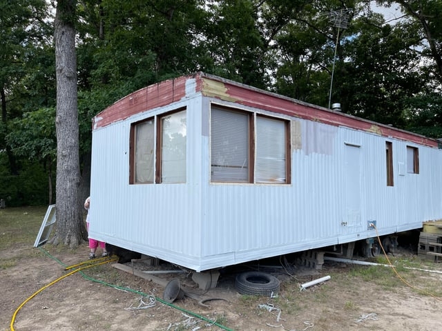 Mobile Home Exterior Renovation: Light Blue Siding with Red Trim