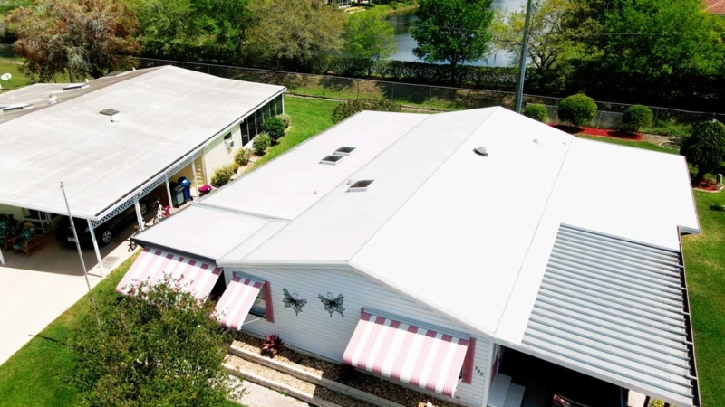 Mobile Home Exterior White Roof Over With Pink Striped Awnings