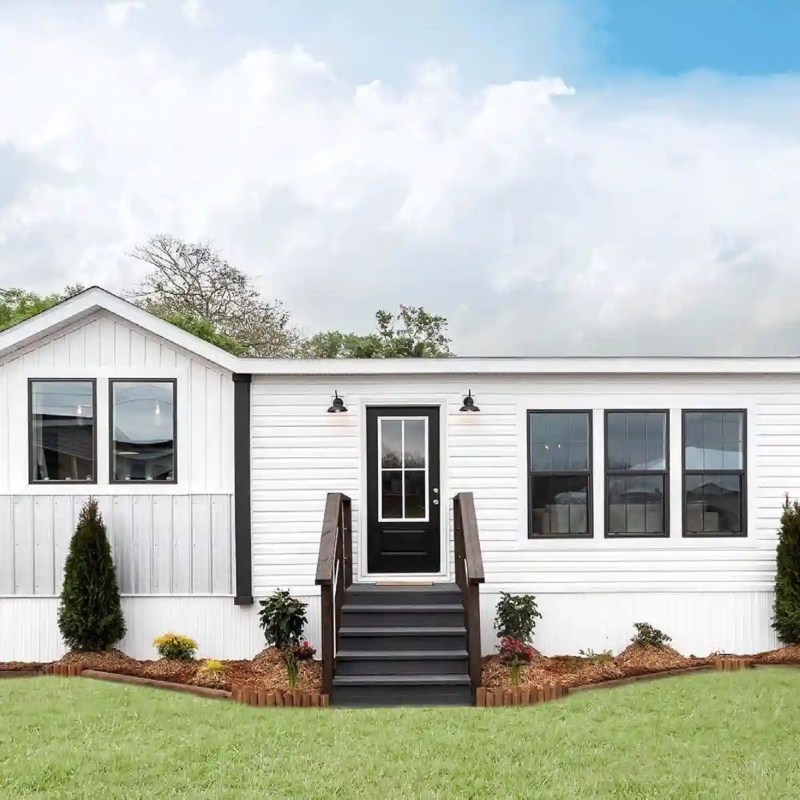 Mobile Home Exterior with High Contrast White Siding and Black Trim