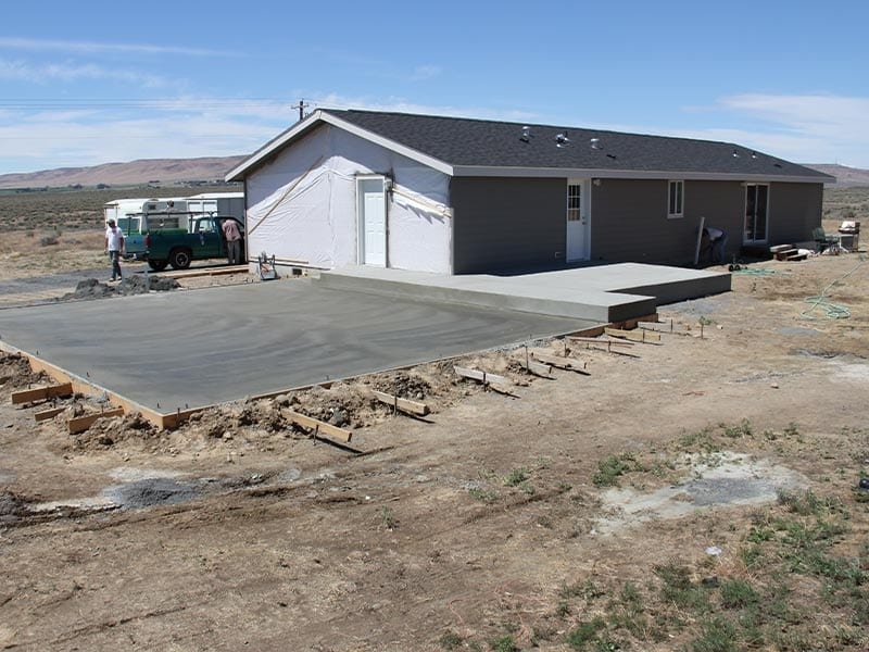 Mobile Home Garage Foundation Addition: Freshly Poured Concrete Slab