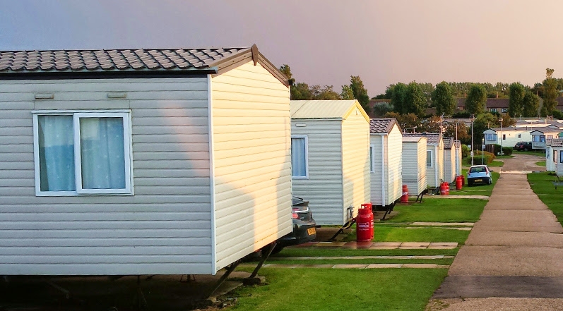 Mobile Home Park Setting with Uniform Pitched Metal Roofs