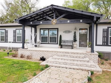 Mobile Home Porch with Brick Steps, High Contrast Siding, and Gabled Roof