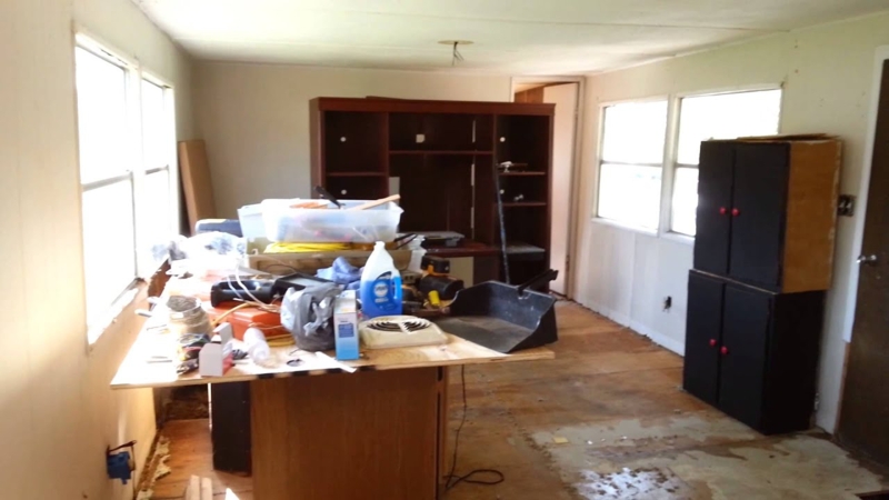 Mobile Home Renovation Ideas: Unfinished Room with Large Storage Hutch