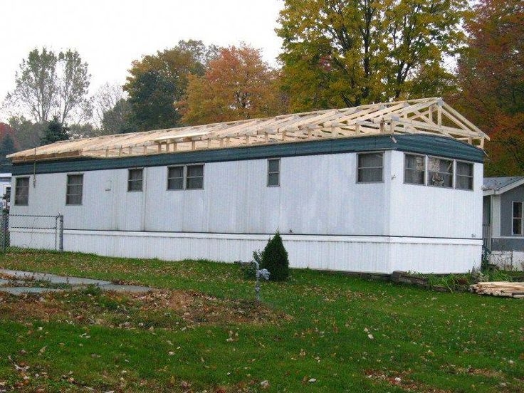 Mobile Home Roof Over Project With Exposed Wooden Trusses
