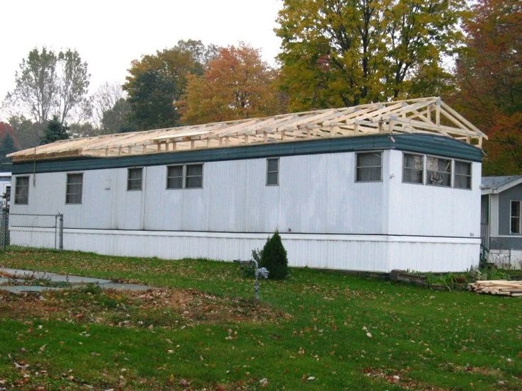 Mobile Home Roof Over with Exposed Wooden Truss Installation