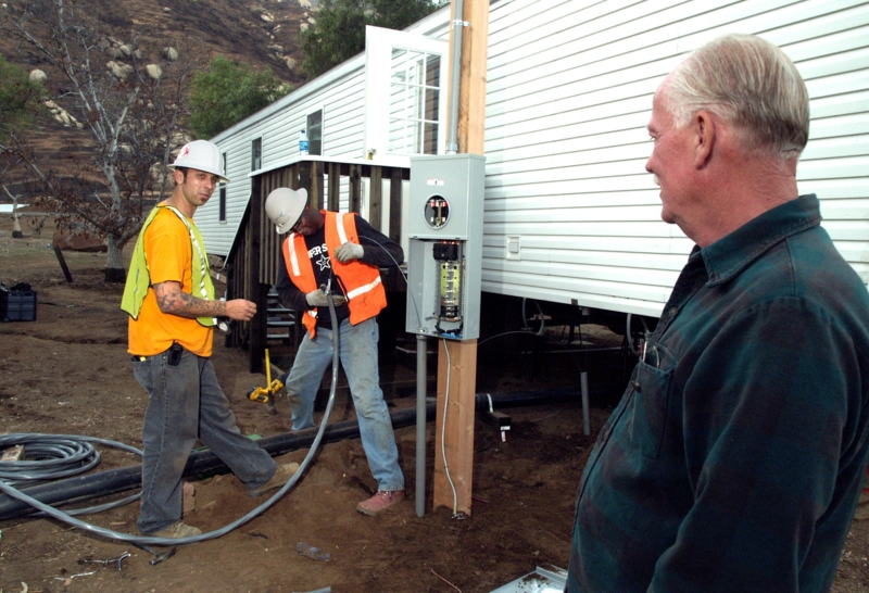 Mobile Home Site showing Exterior Electrical Setup against Vinyl Siding