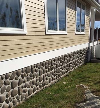 Mobile Home Skirting: Faux River Rock with Tan Siding.