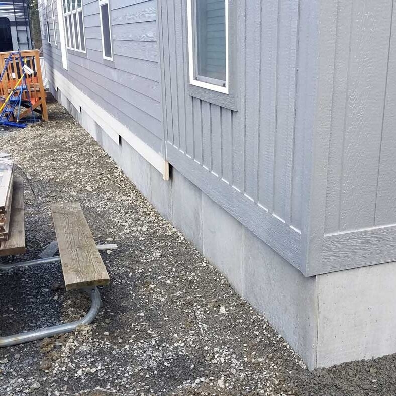 Mobile Home Skirting Panels: Concrete Look with Grey Vertical Siding