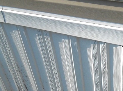 Mobile Home Skirting with Perforated Vents and Vertical Panels