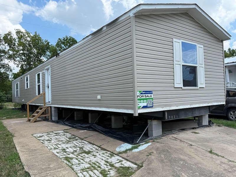 Mobile Home Traditional Tan Siding with White Louvered Shutters Design