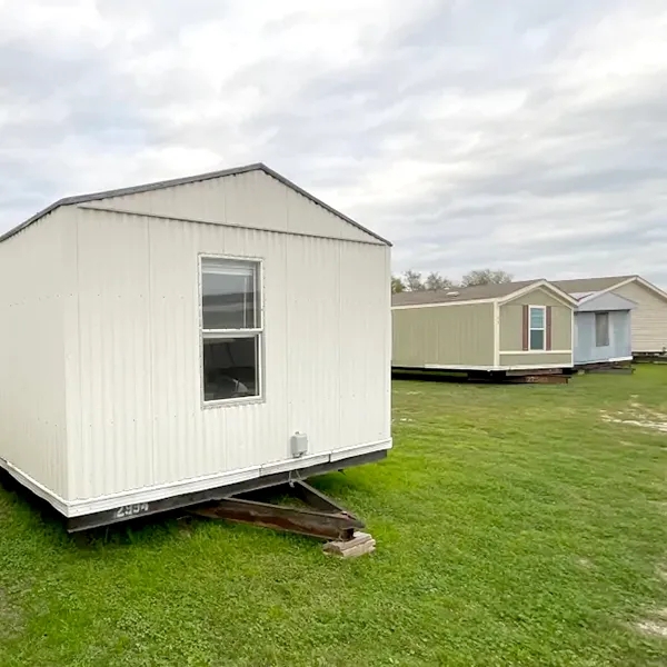 Mobile Home with Corrugated Metal Siding and Tow-Ready Chassis