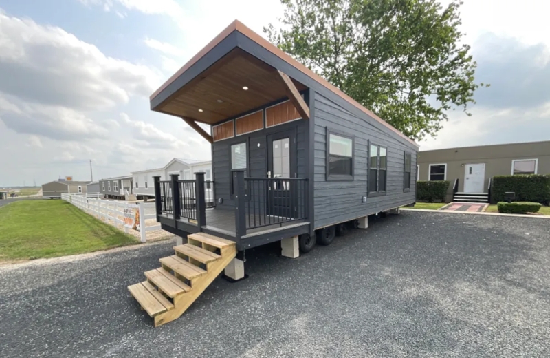 Mobile Home with Slanted Roofline and Charcoal Siding Porch