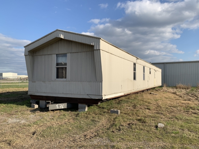 Mobile Home with Tan Corrugated Metal Siding and Gable End Design