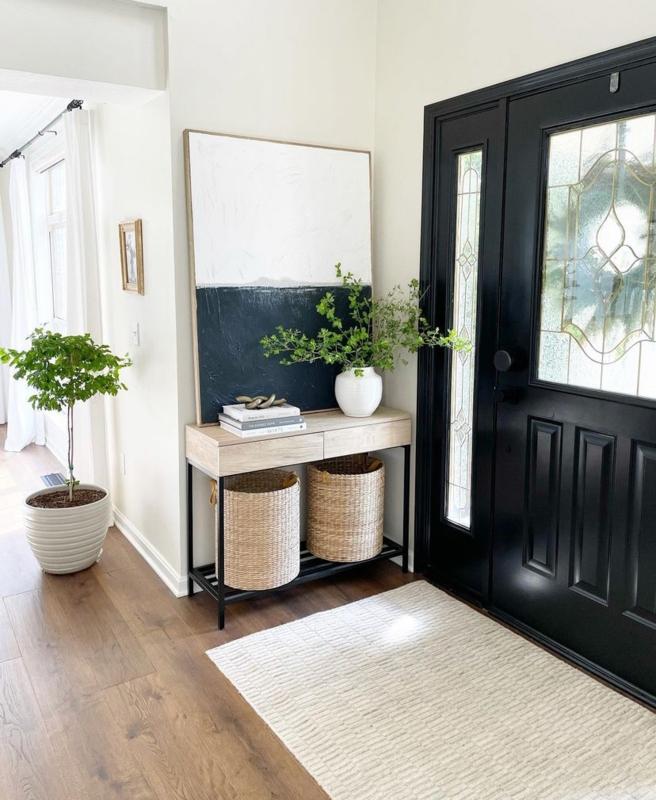 Modern Console Table: Large Leaning Art, Baskets, & Black Door