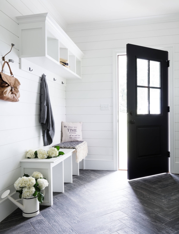 Modern Farmhouse Entryway: Black Door, Herringbone Floor, & Storage