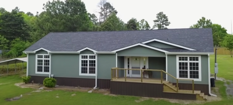 Modern Farmhouse Exterior: Sage Green Siding, Dark Brown Skirting