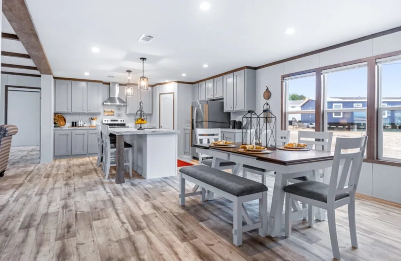 Modern Farmhouse Kitchen Dining Combo with Grey Cabinets and Island