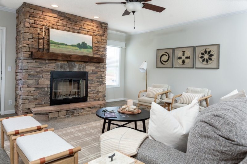 Modern Farmhouse Living Room anchored by Floor-to-Ceiling Stone Fireplace