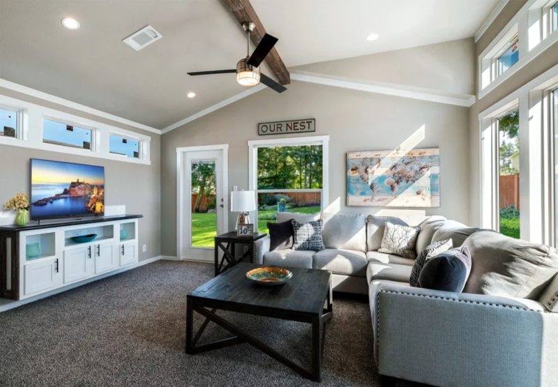 Modern Farmhouse Living Room with Vaulted Ceiling and Exposed Beam