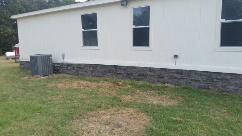 Modern Farmhouse Stone Skirting with High Contrast Foundation Look