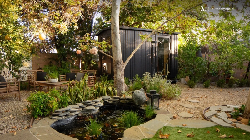Modern Garden Studio with Stone Lined Pond & Gravel Landscaping Layout