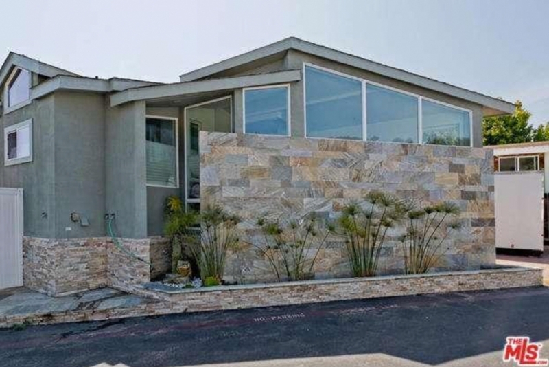 Modern Home Exterior Stacked Stone Wall Shed Roofline Clerestory Windows