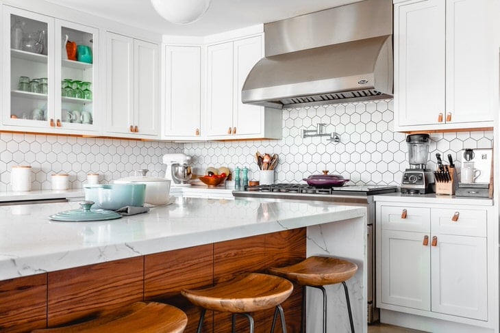 Modern Kitchen Island with Wood Paneling: Sculpted Bar Stools & Tile