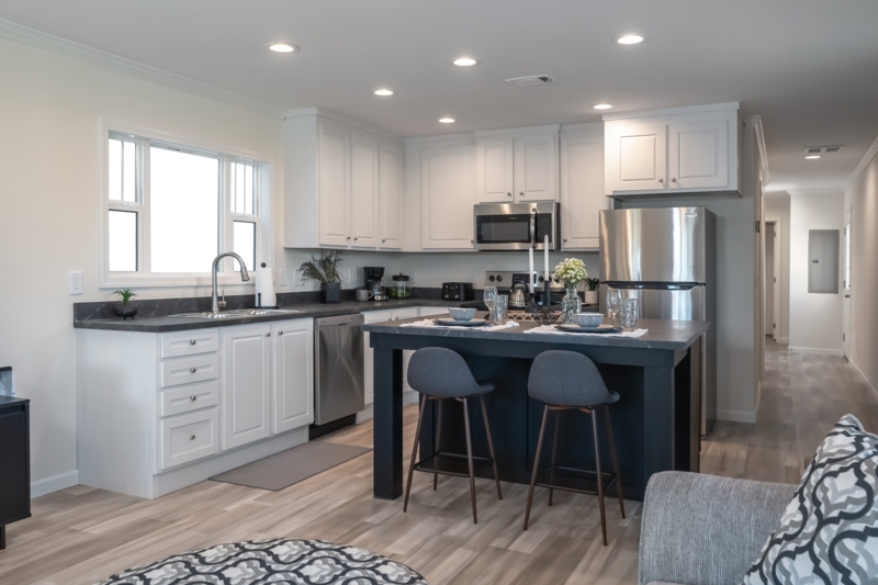 Modern Kitchen with High Contrast Island and White Shaker Cabinets