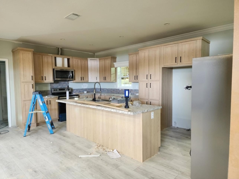 Modern Kitchen with Light Wood Cabinets and Large Central Island