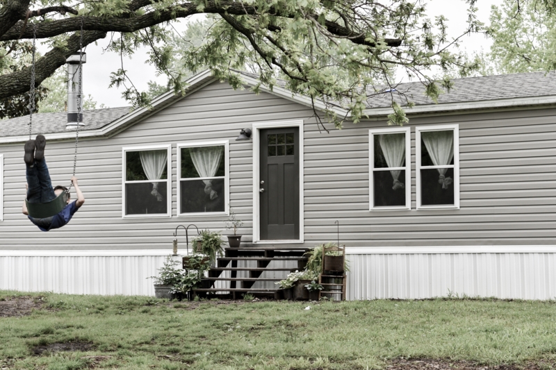 Modern Manufactured Home Exterior Ideas: Grey Siding & Tree Swing