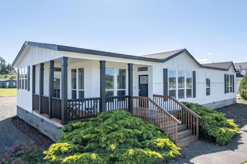 Modern Manufactured Home with Black Pillars & Wood Steps