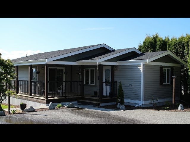 Modern Mobile Home Exterior Renovation: Gray Siding & Black Railing