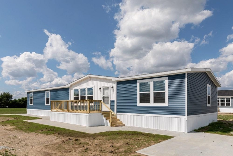 Modern Mobile Home Exterior with Two Tone Siding and White Vertical Skirting