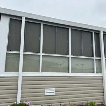 Modern Sunroom Screen Enclosure with White Framed Sliding Panels