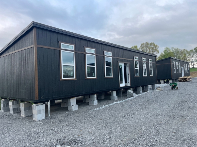 Modular Cabin Shell: Vertical Siding and Transom Windows on Blocks