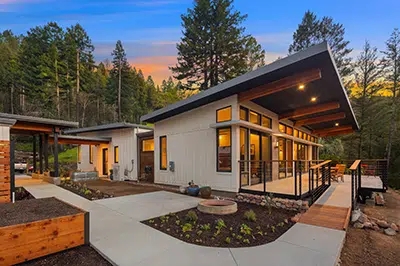 Modular Home Exterior: Dramatic Shed Roof, Exposed Wooden Rafters