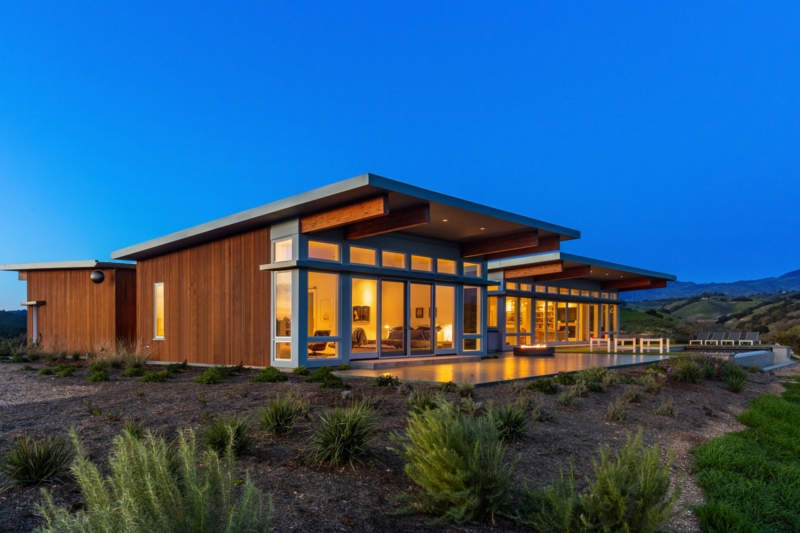 Modular Home featuring Vertical Wood Cladding and Extensive Glazing.