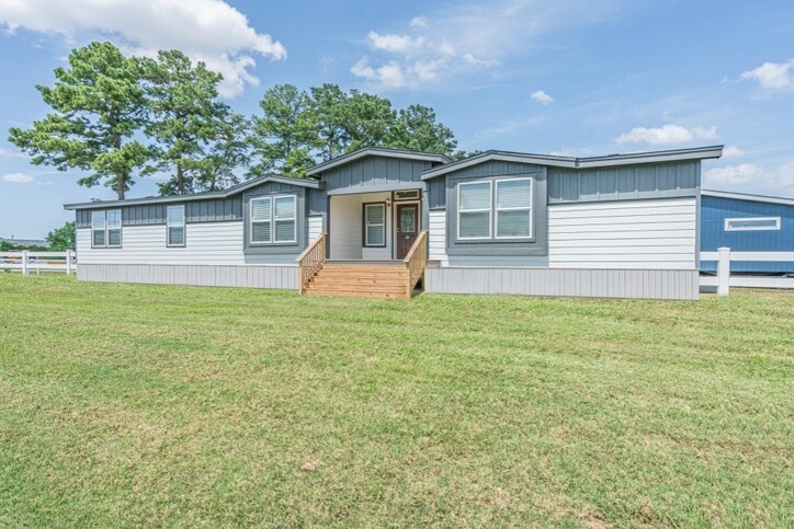 Modular Home Two Tone Siding Vertical Paneling Wooden Entry