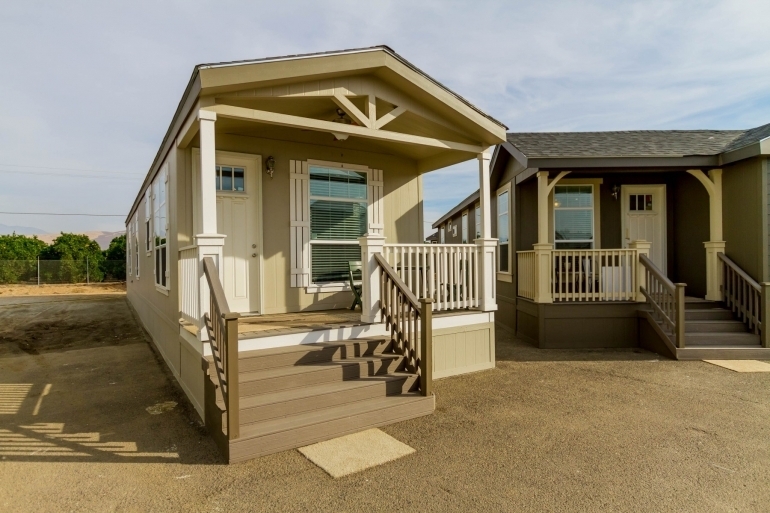 Modular Home with Gabled Porch and Dual-Tone Siding.
